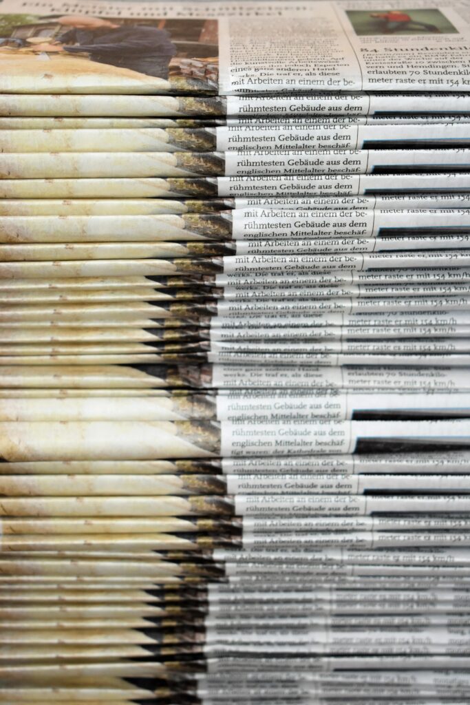 Stack of newspapers via Waldemar on Unsplash
